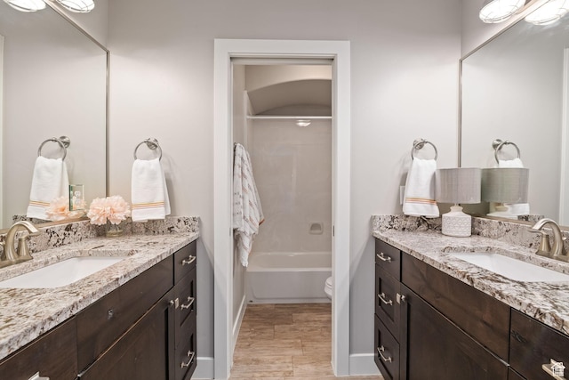 2914 E 1880 S, St George, UT 84790 - bathroom with vanity, baseboards, toilet, bathing tub / shower combination, and wood finished floors