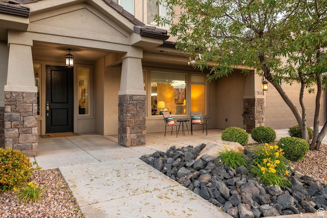 2914 E 1880 S, St George, UT 84790 - property entrance with stone siding, stucco siding, and a porch