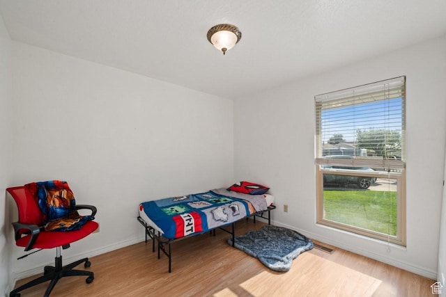 2045 W 5025 S, Roy, UT 84067 - bedroom featuring wood finished floors and baseboards