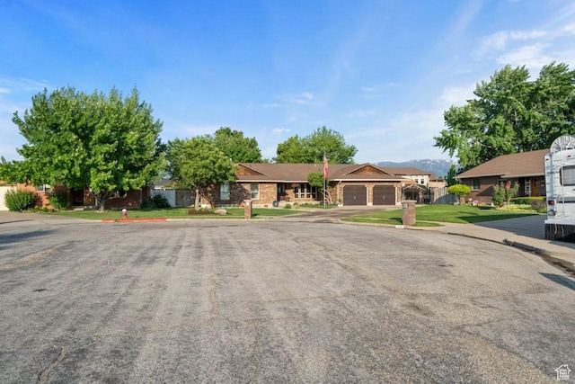2045 W 5025 S, Roy, UT 84067 - ranch-style home featuring an attached garage and a front lawn