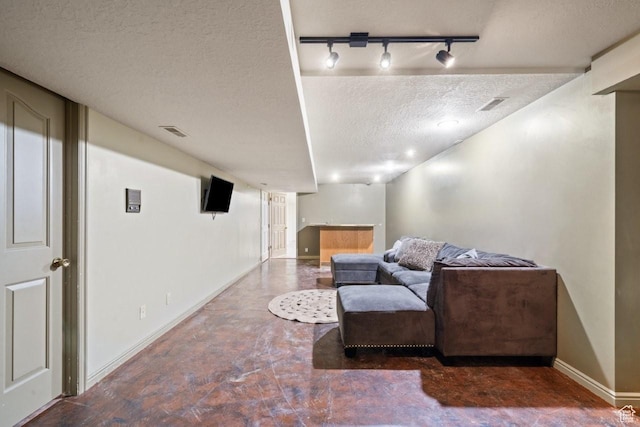 2045 W 5025 S, Roy, UT 84067 - living area with a textured ceiling, track lighting, and finished concrete flooring