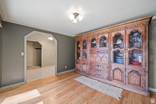 2045 W 5025 S, Roy, UT 84067 - entrance foyer featuring arched walkways, light wood-style floors, and crown molding