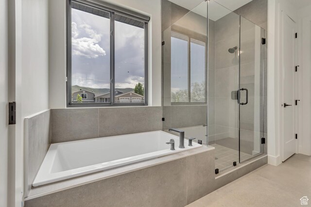 13393 S Sky Ranch Rd, Herriman, UT 84096 - bathroom featuring healthy amount of natural light, a bath, and a stall shower