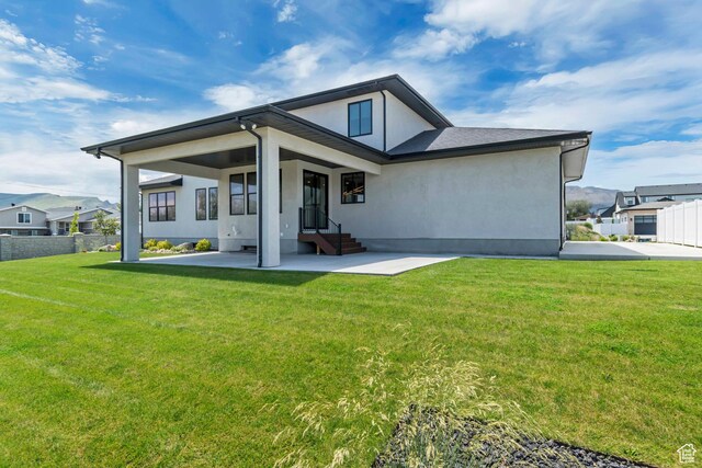 13393 S Sky Ranch Rd, Herriman, UT 84096 - rear view of house featuring stucco siding and a patio area