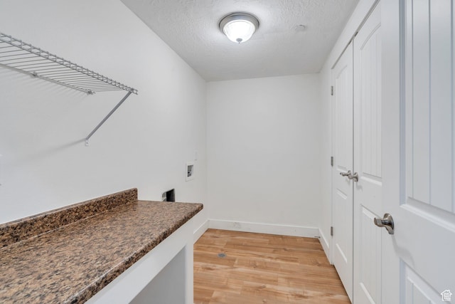 143 W Spring Hill Way N, Saratoga Springs, UT 84045 - laundry area with light wood finished floors, hookup for a washing machine, a textured ceiling, and baseboards