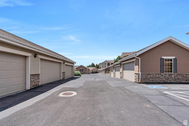 143 W Spring Hill Way N, Saratoga Springs, UT 84045 - view of asphalt road featuring community garages and a residential view