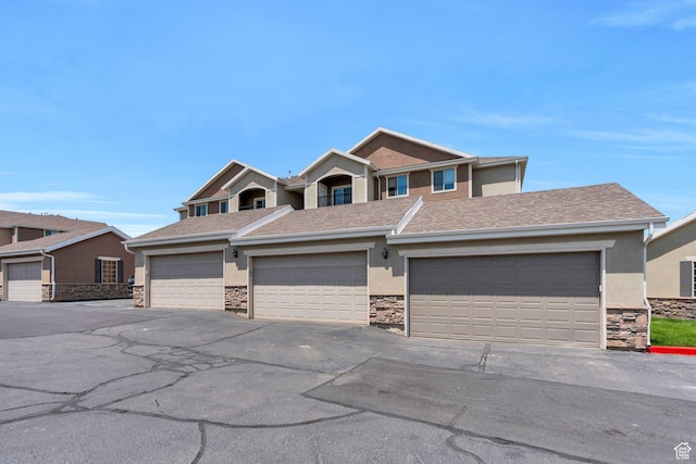 143 W Spring Hill Way N, Saratoga Springs, UT 84045 - view of front facade with stucco siding, stone siding, and roof with shingles
