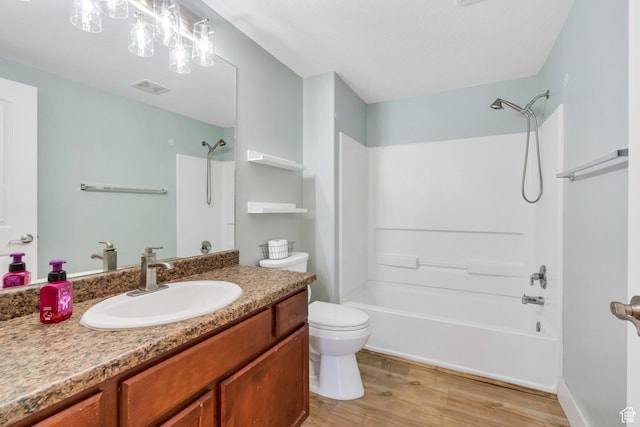 143 W Spring Hill Way N, Saratoga Springs, UT 84045 - full bathroom with wood finished floors, toilet, vanity, and bathing tub / shower combination