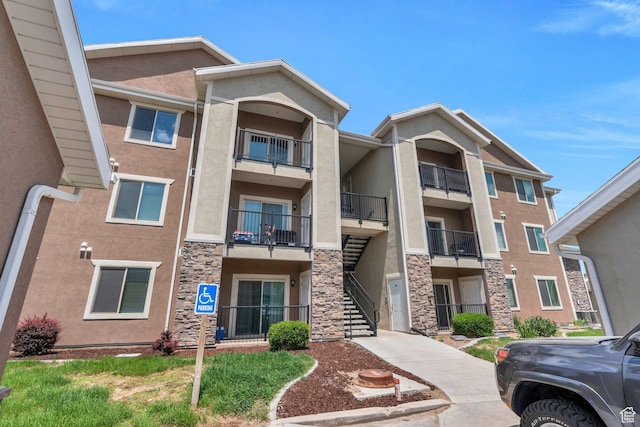 143 W Spring Hill Way N, Saratoga Springs, UT 84045 - view of apartment building / complex featuring stairway
