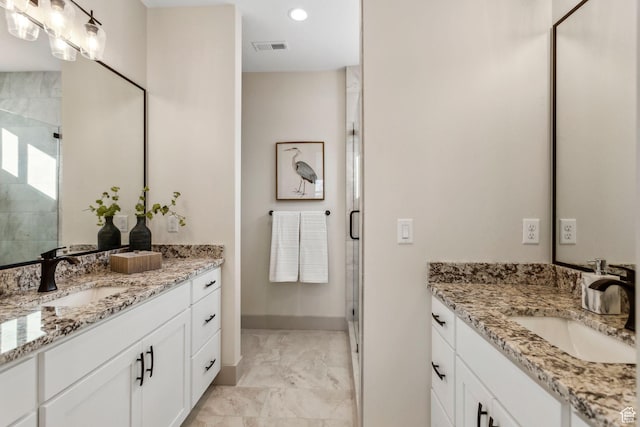 345 E 100 S, Santaquin, UT 84655 - full bath with a shower stall, two vanities, marble look tile flooring, and recessed lighting