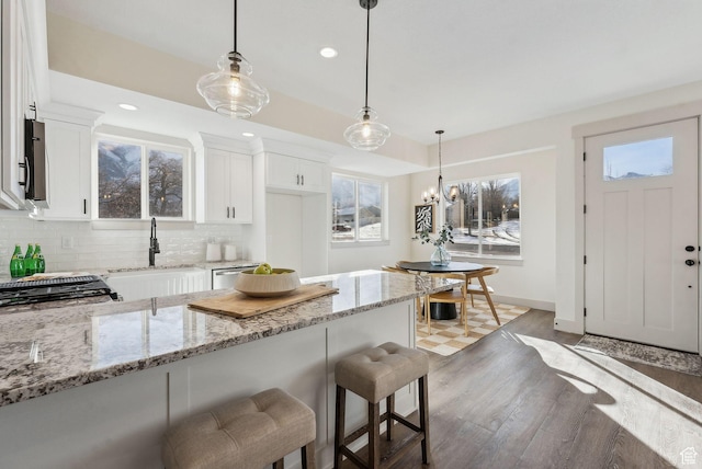 345 E 100 S, Santaquin, UT 84655 - kitchen with a sink, light wood-style flooring, light stone countertops, plenty of natural light, and recessed lighting