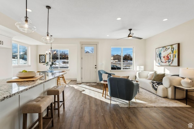 345 E 100 S, Santaquin, UT 84655 - living room featuring dark wood-style floors, recessed lighting, a ceiling fan, a chandelier, and baseboards