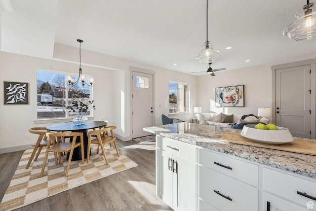 345 E 100 S, Santaquin, UT 84655 - kitchen featuring wood finished floors, a chandelier, white cabinetry, recessed lighting, and baseboards