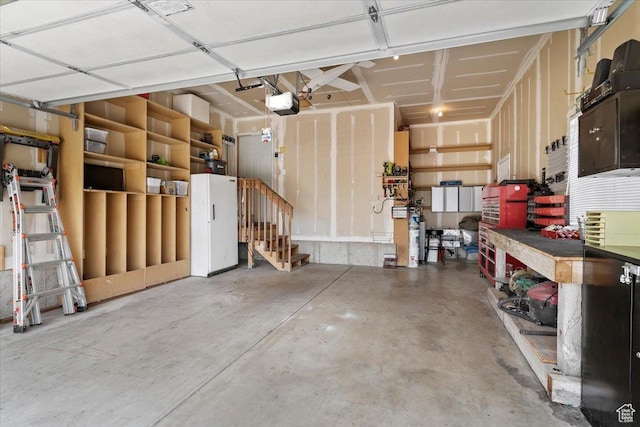 1403 Gleneagles Dr, Syracuse, UT 84075 - garage featuring a garage door opener and a workshop area