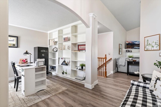 1403 Gleneagles Dr, Syracuse, UT 84075 - office area with arched walkways, wood finished floors, baseboards, crown molding, and a textured ceiling