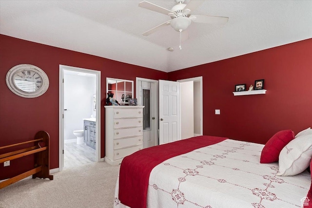 1403 Gleneagles Dr, Syracuse, UT 84075 - carpeted bedroom with connected bathroom, baseboards, and a ceiling fan