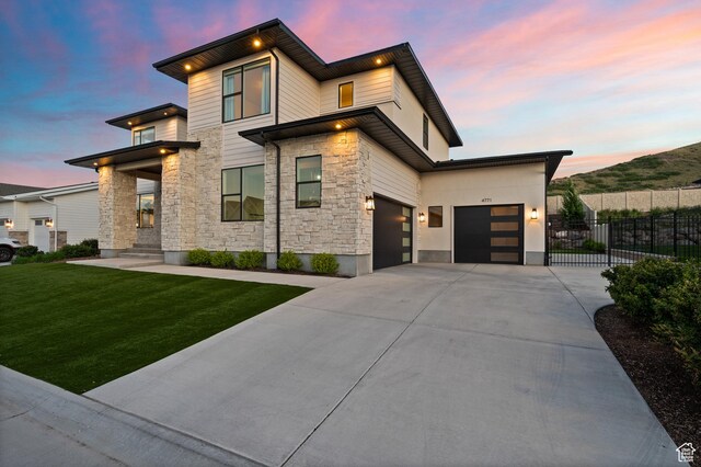 4771 W Juniper Bend Cir, Herriman, UT 84096 - contemporary house featuring stone siding, driveway, and an attached garage