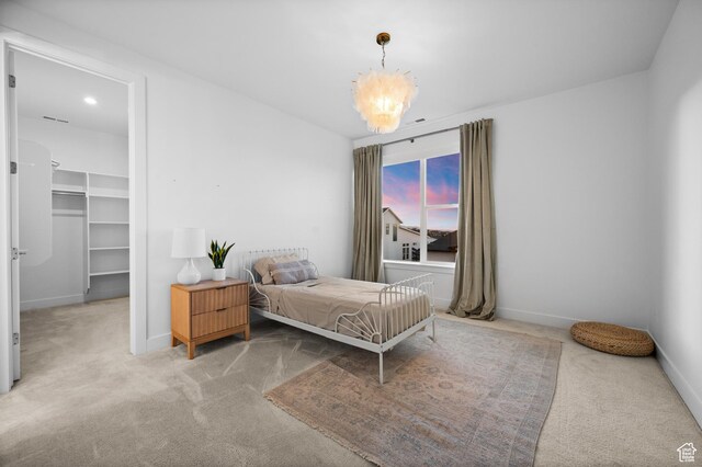 4771 W Juniper Bend Cir, Herriman, UT 84096 - carpeted bedroom featuring a spacious closet, a chandelier, and baseboards