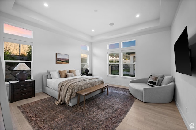 4771 W Juniper Bend Cir, Herriman, UT 84096 - bedroom with a tray ceiling, light wood-type flooring, recessed lighting, and baseboards