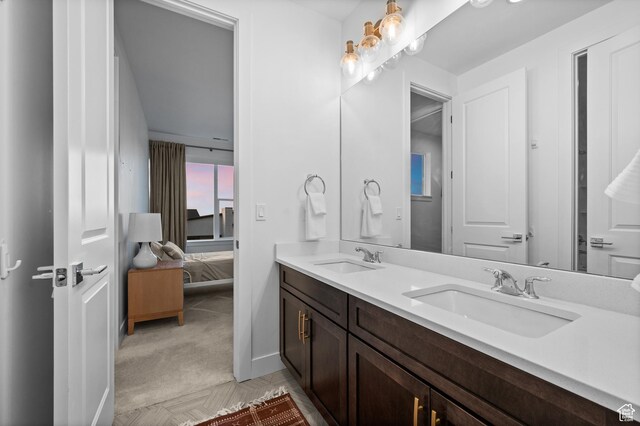 4771 W Juniper Bend Cir, Herriman, UT 84096 - ensuite bathroom with double vanity and baseboards