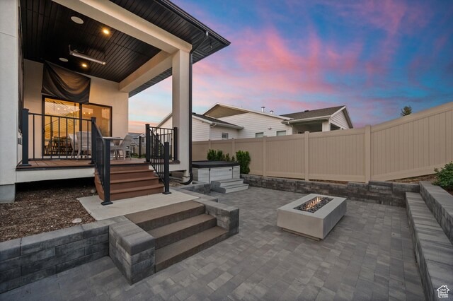4771 W Juniper Bend Cir, Herriman, UT 84096 - fenced backyard with a fire pit, a hot tub, a patio area, and a deck