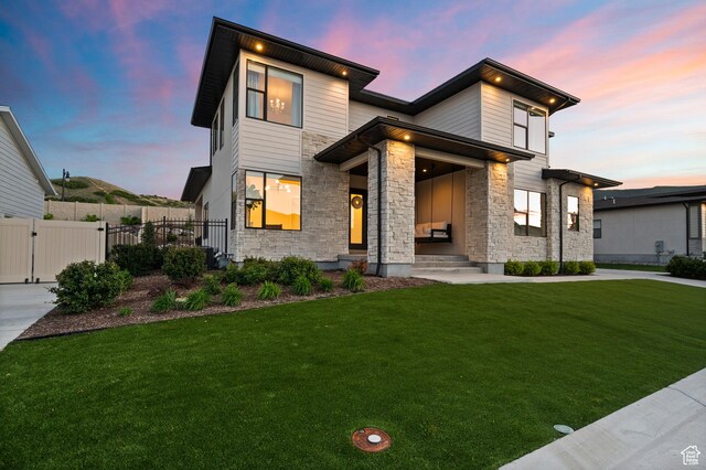 4771 W Juniper Bend Cir, Herriman, UT 84096 - modern home featuring stone siding and a gate