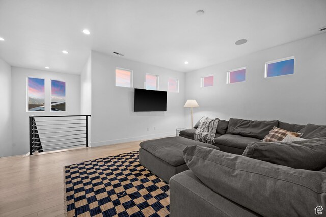4771 W Juniper Bend Cir, Herriman, UT 84096 - living area with wood finished floors, recessed lighting, and baseboards