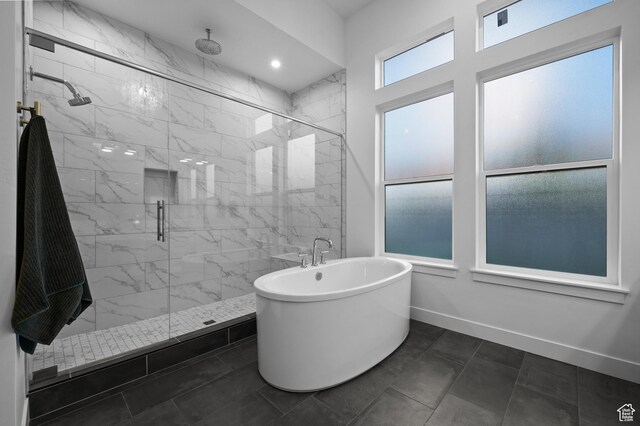 4771 W Juniper Bend Cir, Herriman, UT 84096 - bathroom featuring a freestanding tub, a marble finish shower, and baseboards