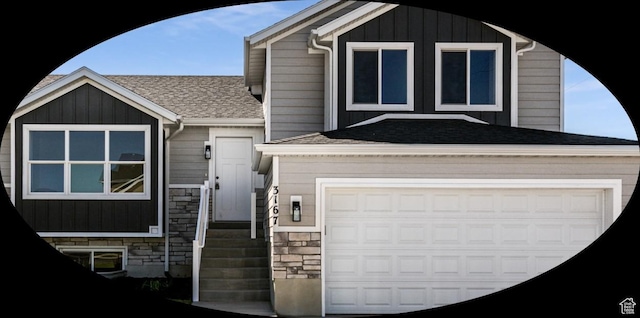 3167 W 5700 S, Roy, UT 84067 - view of front of home with a shingled roof, a garage, and stone siding