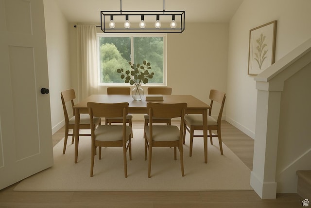 3167 W 5700 S, Roy, UT 84067 - dining room featuring wood finished floors, baseboards, and stairway