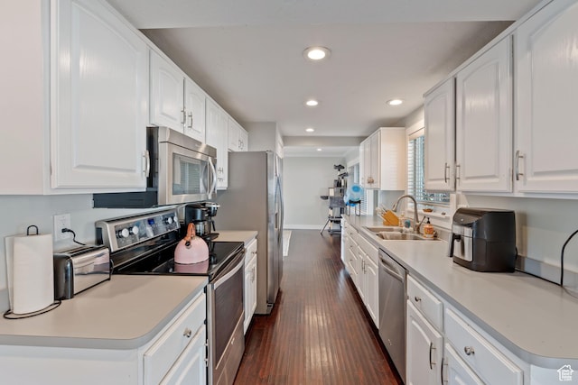 221 S 200 E, Centerville, UT 84014 - kitchen with appliances with stainless steel finishes, a sink, dark wood-style floors, recessed lighting, and white cabinets
