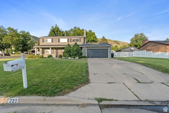 221 S 200 E, Centerville, UT 84014 - view of front of house with concrete driveway, a garage, and a mountain view