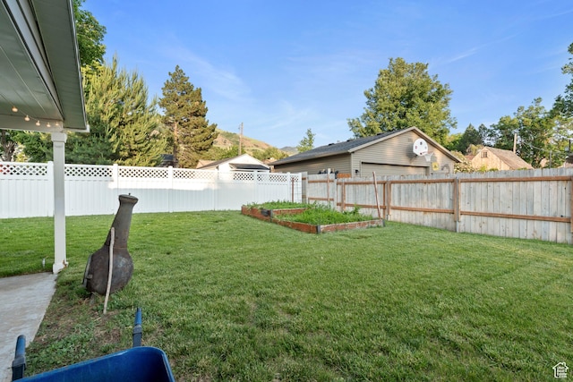 221 S 200 E, Centerville, UT 84014 - view of yard featuring a garden and a detached garage