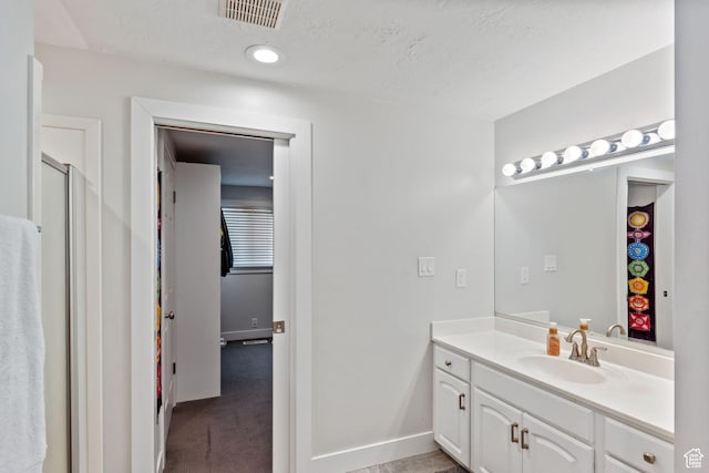 221 S 200 E, Centerville, UT 84014 - full bath with vanity, baseboards, a shower, and a textured ceiling