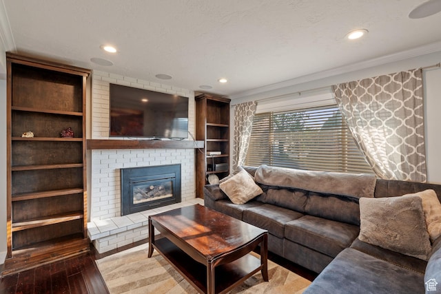 221 S 200 E, Centerville, UT 84014 - living area featuring crown molding, hardwood / wood-style flooring, a fireplace, and recessed lighting