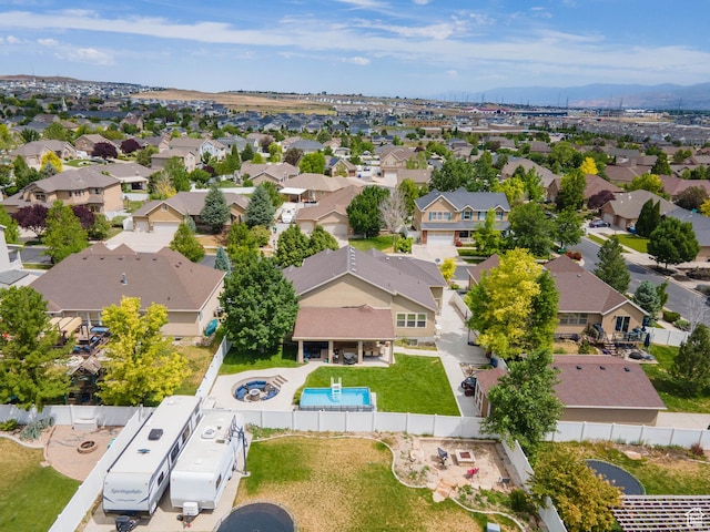 6121 W Indian Oak Dr S, West Jordan, UT 84081 - aerial view of residential area with a pool area and mountains