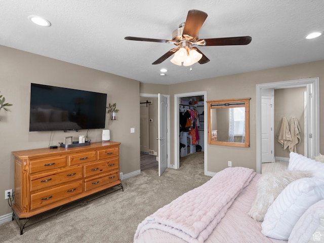 6121 W Indian Oak Dr S, West Jordan, UT 84081 - bedroom featuring baseboards, a spacious closet, light carpet, recessed lighting, and ceiling fan