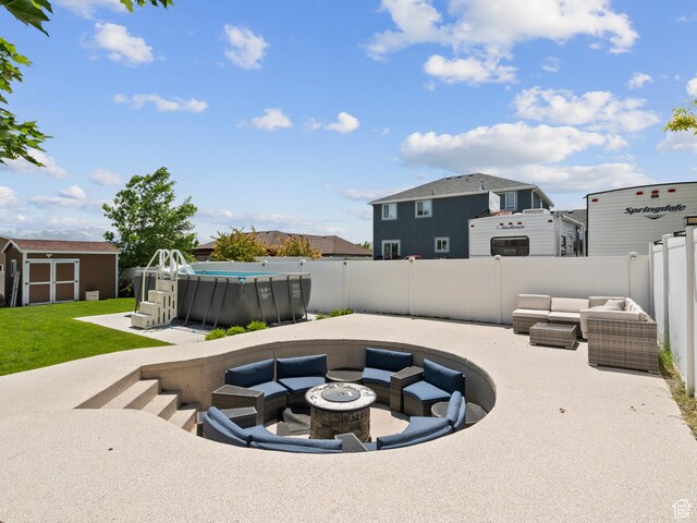 6121 W Indian Oak Dr S, West Jordan, UT 84081 - fenced backyard with an outdoor living space with a fire pit, a patio, and a residential view