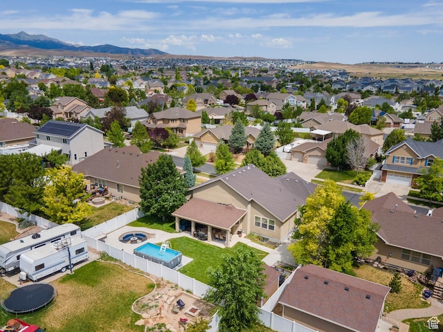 6121 W Indian Oak Dr S, West Jordan, UT 84081 - aerial view of residential area with a pool area and mountains