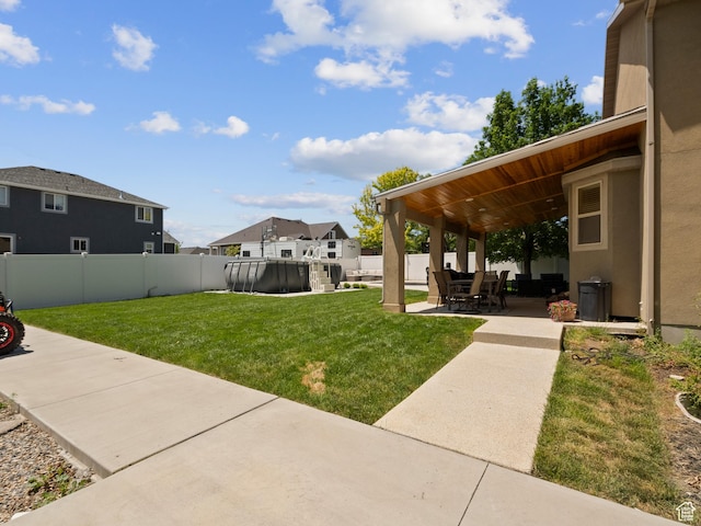 6121 W Indian Oak Dr S, West Jordan, UT 84081 - view of yard featuring a patio area and a swimming pool