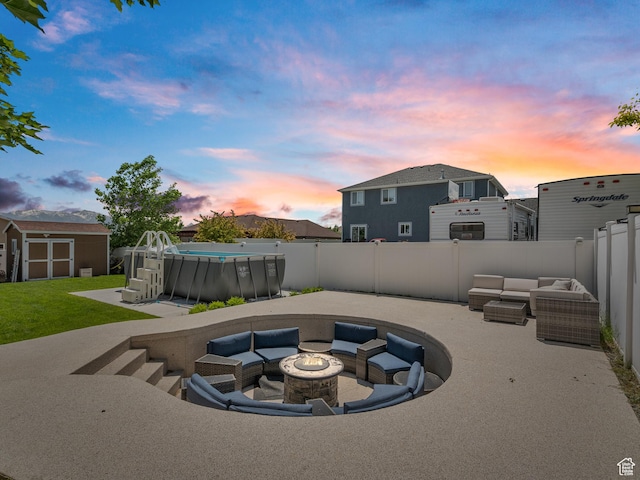 6121 W Indian Oak Dr S, West Jordan, UT 84081 - fenced backyard with an outdoor living space with a fire pit and a patio area