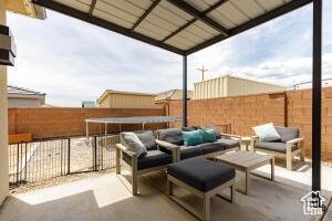 3454 W 150th St N, Hurricane, UT 84737 - fenced backyard with an outdoor living space and a patio area