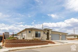 3454 W 150th St N, Hurricane, UT 84737 - view of front of property featuring an attached garage and concrete driveway