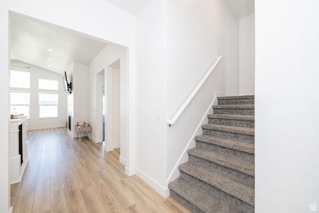 5258 W 3750 S, Hooper, UT 84315 - stairway featuring lofted ceiling, wood finished floors, and baseboards