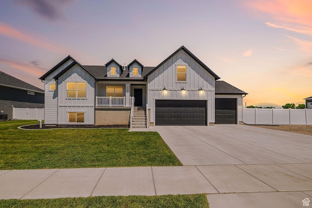 5258 W 3750 S, Hooper, UT 84315 - modern inspired farmhouse featuring board and batten siding, covered porch, concrete driveway, and an attached garage