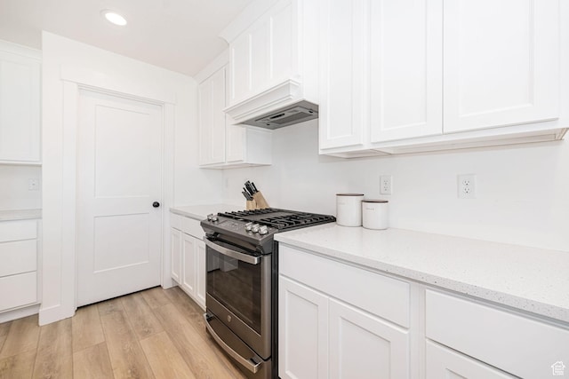 5258 W 3750 S, Hooper, UT 84315 - kitchen with stainless steel gas range oven, custom exhaust hood, light wood finished floors, white cabinetry, and recessed lighting