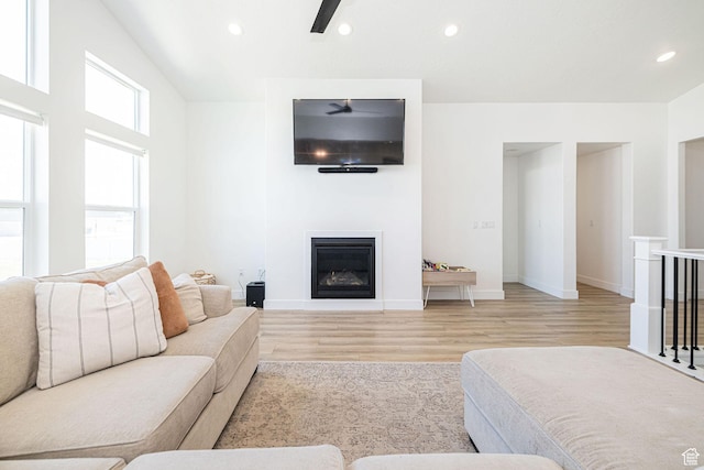 5258 W 3750 S, Hooper, UT 84315 - living room with wood finished floors, recessed lighting, ceiling fan, a glass covered fireplace, and baseboards