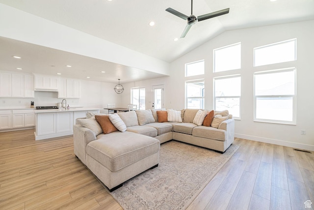 5258 W 3750 S, Hooper, UT 84315 - living room featuring light wood-style flooring, recessed lighting, a ceiling fan, high vaulted ceiling, and baseboards