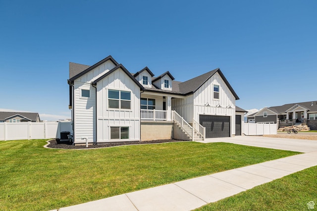5258 W 3750 S, Hooper, UT 84315 - modern farmhouse style home with board and batten siding, a garage, concrete driveway, and a porch