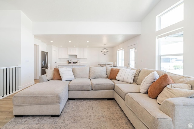 5258 W 3750 S, Hooper, UT 84315 - living room featuring light wood-style flooring, a chandelier, and recessed lighting